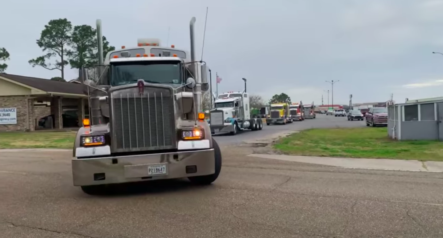 Dozens of semis convoy for fallen trucking company owner, veteran